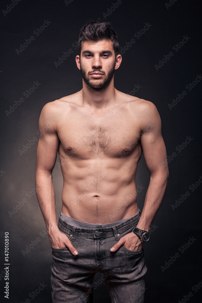 Fototapeta premium handsome man, shirtless, hands in pockets