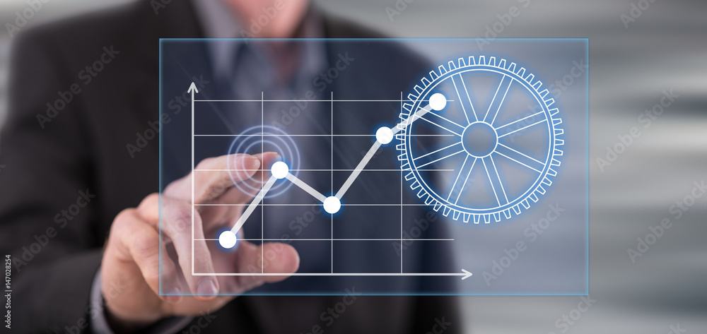 Fototapeta premium Man touching a digital business analysis concept on a touch screen