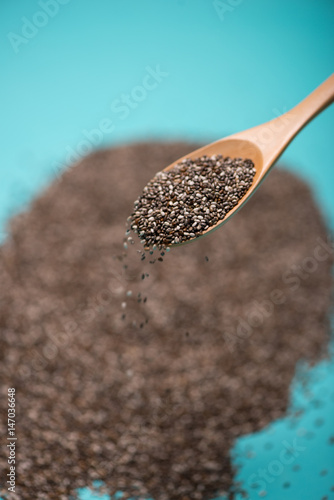 Close-up of ealthy chia seeds in a spoon. Text space. photo