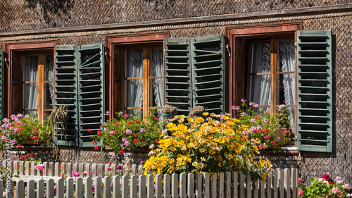 Biberschindelfassade eines alten Bauernhauses in Schlosswil Kanton Bern photo