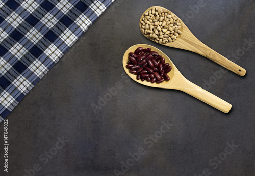 Soy bean and red bean on dark wooden, top view