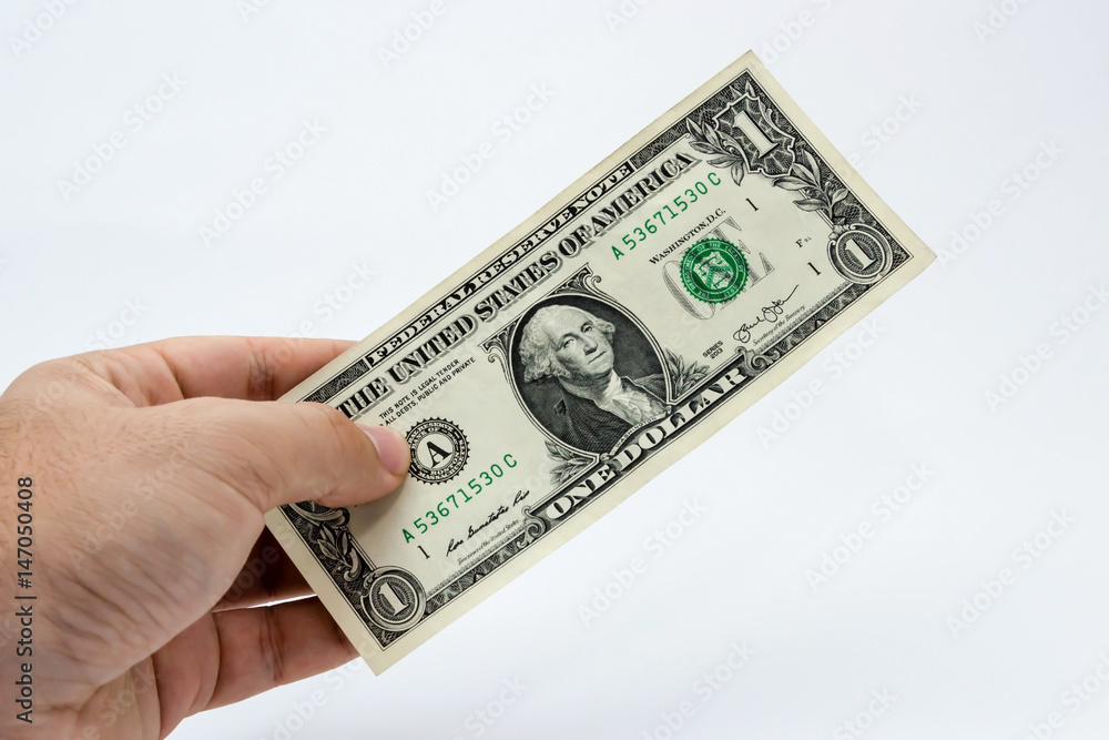 A close up photo of a Caucasian male hand holding a 1 dollar USA note A close up photo of a Caucasian male hand holding a 1 dollar USA note