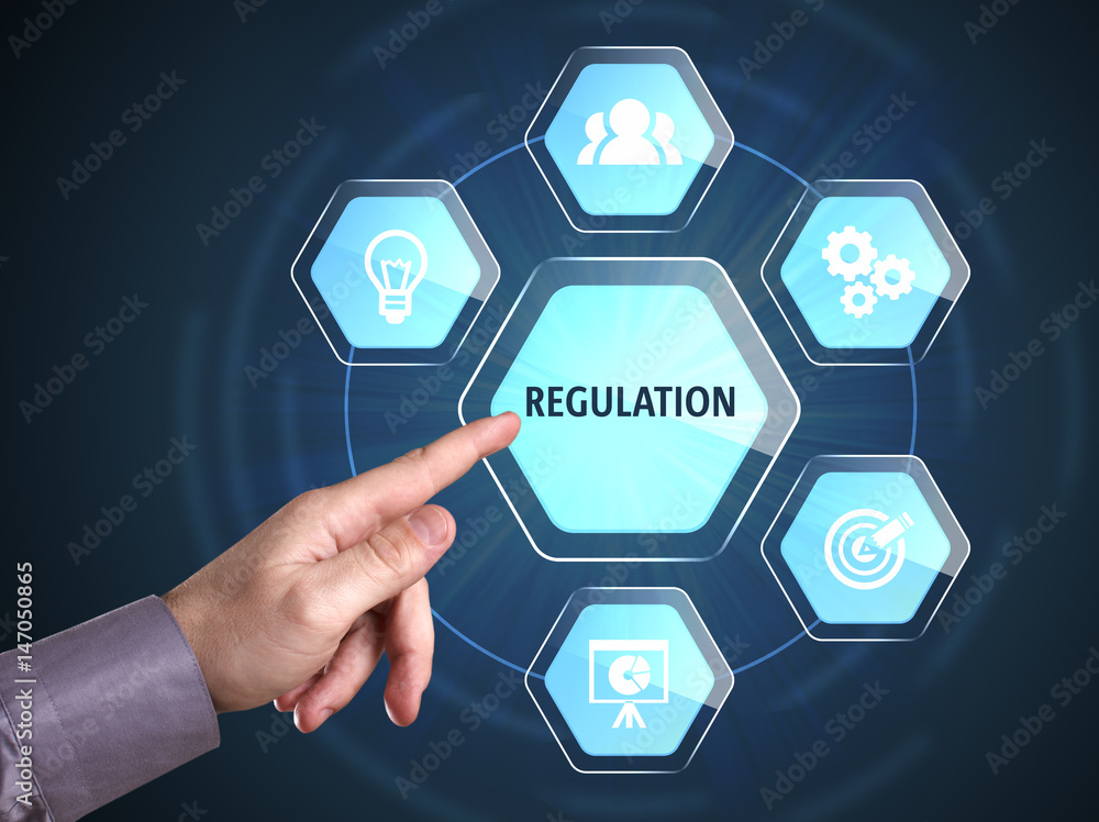 Business, Technology, Internet and network concept. Young businessman shows the word: Regulation Business, Technology, Internet and network concept. Young businessman shows the word: Regulation