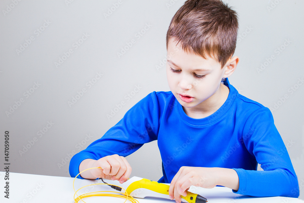 Kid drawing with 3d printing pen. Creative, technology, leisure, education concept Kid drawing with 3d printing pen. Creative, technology, leisure, education concept
