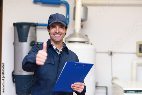 Smiling plumber at work