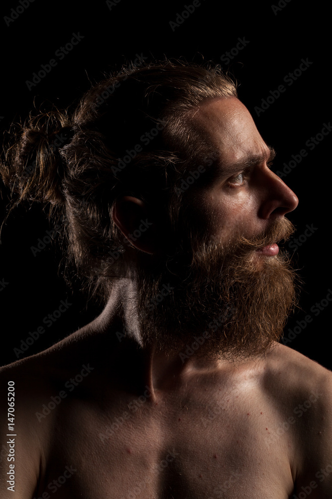 Cool bearded hipster on black background in studio photo. Expression and fashion Cool bearded hipster on black background in studio photo. Expression and fashion