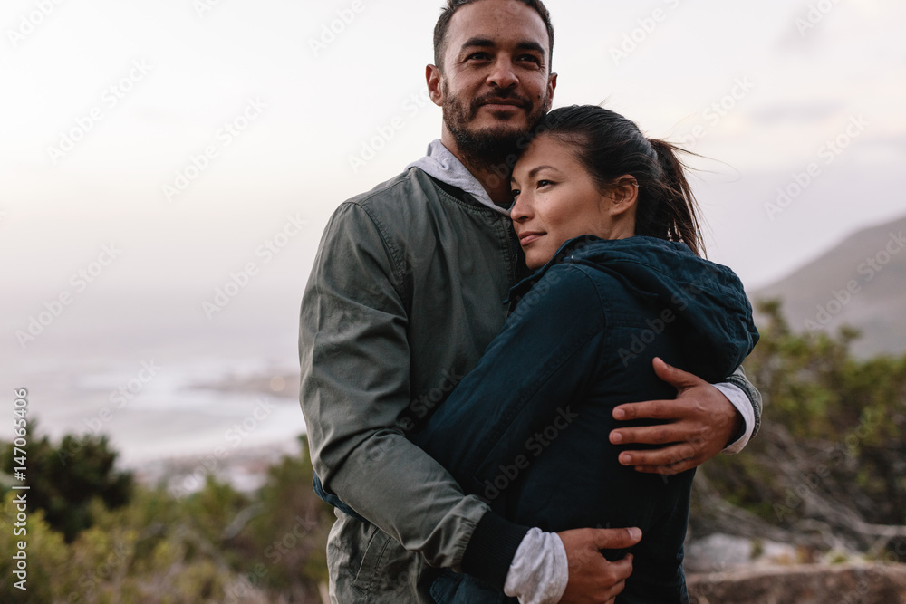 Couple in love embracing in nature