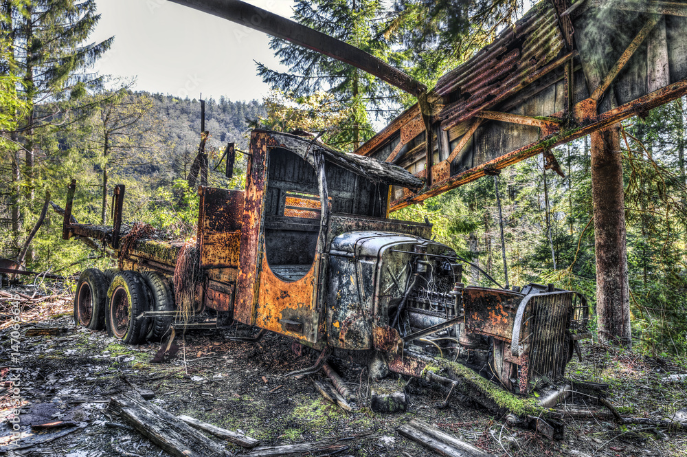 Forgotten truck wreck in an abandoned quarry Forgotten truck wreck in an abandoned quarry