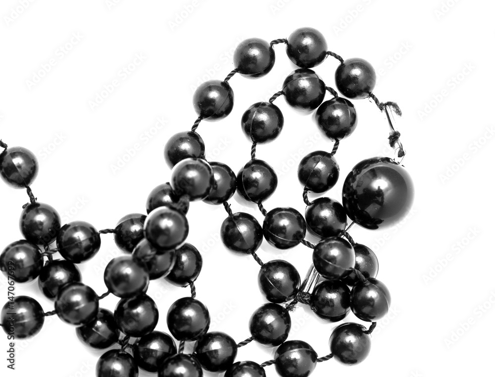 Black beads on a white background Black beads on a white background