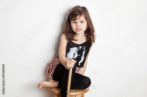 Llittle actress sitting on chair  photo