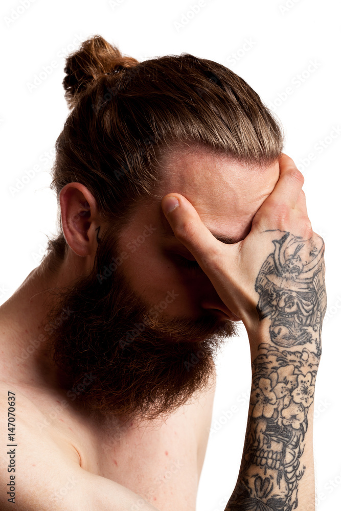 Fototapeta premium Cool guy with long beard over white background in studio photo