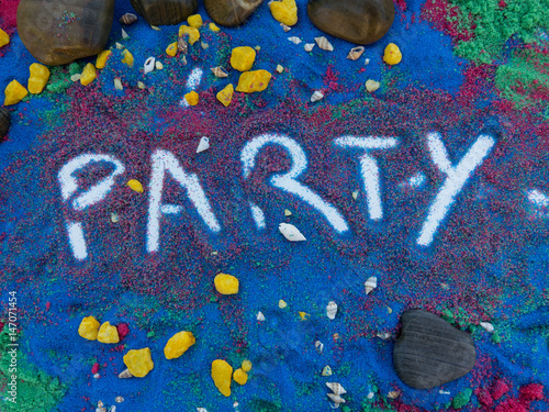 scritta party sulla spiaggia colorata  photo