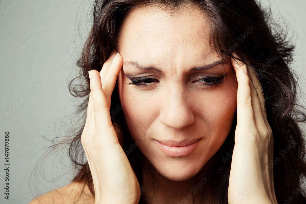 Woman suffering from headache Woman suffering from headache