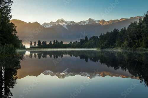 Lake Matheson. Locate near the Fox Glacier in West Coast of South Island of New Zealand.It is famous for its reflected views of Aoraki/Mount Cook and Mount Tasman. photo