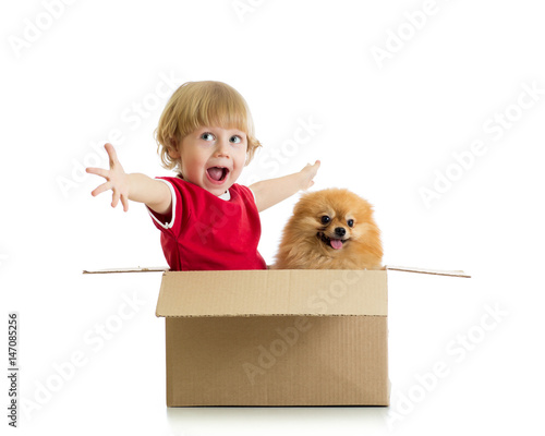 Smiling child and dog in ca...