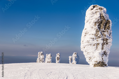 Shaman and his brothers (Manpupuner rock formations)