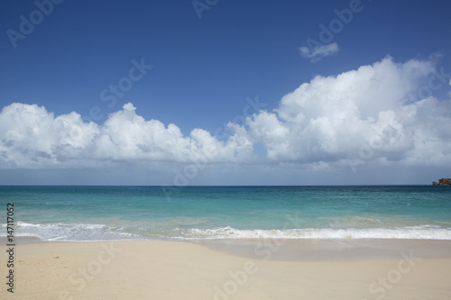 Beach scene Antigua  showing sand  sea and blue sky