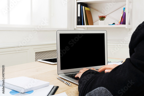Business man at office workplace works with laptop