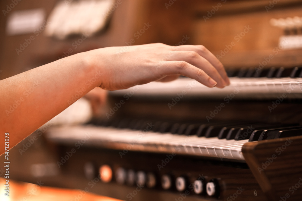 Hands of a woman playing the organ Hands of a woman playing the organ