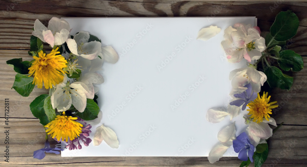 Blank page of a notebook and spring flowers Blank page of a notebook and spring flowers