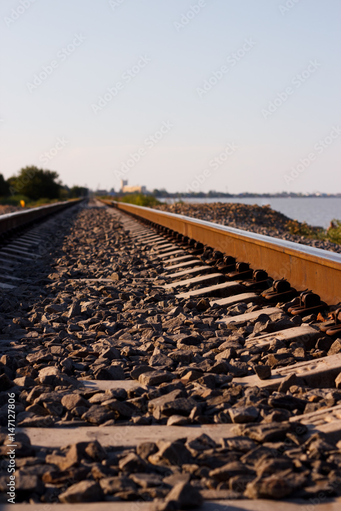 Railroad going to the distance near the shore