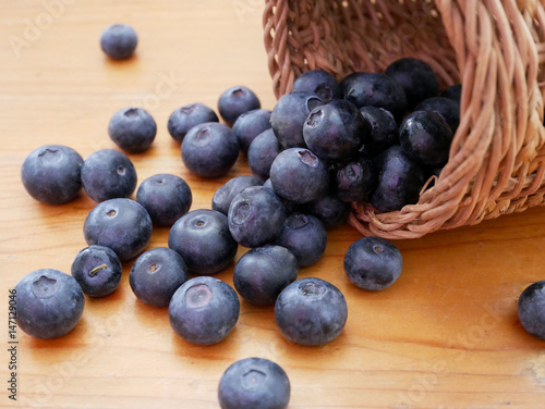 Blueberry antioxidant organic superfood on wooden table. Concept for healthy eating and nutrition