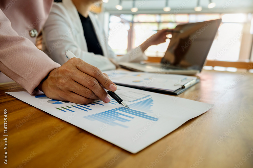 Business concept. Business people discussing the charts and graphs showing the results of their successful teamwork. Selective focus. Business concept. Business people discussing the charts and graphs showing the results of their successful teamwork. Selective focus.