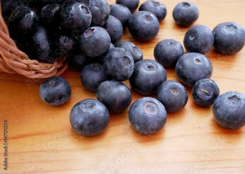 Blueberries on a wooden table. Concept for diet or healthy diet with berries.