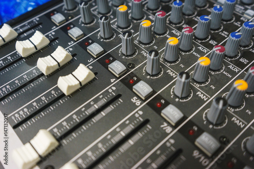 Sound equipment for a nightclub, discotheque or recording studio. The mixing console of the sound engineer in operation. 