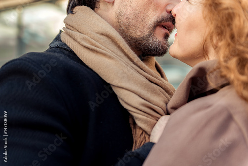 Sensual man and woman enjoying first kiss