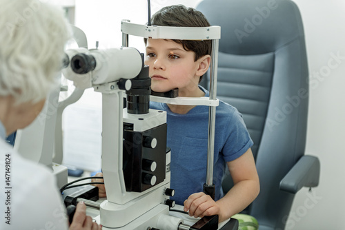 Checking vision of little kid photo