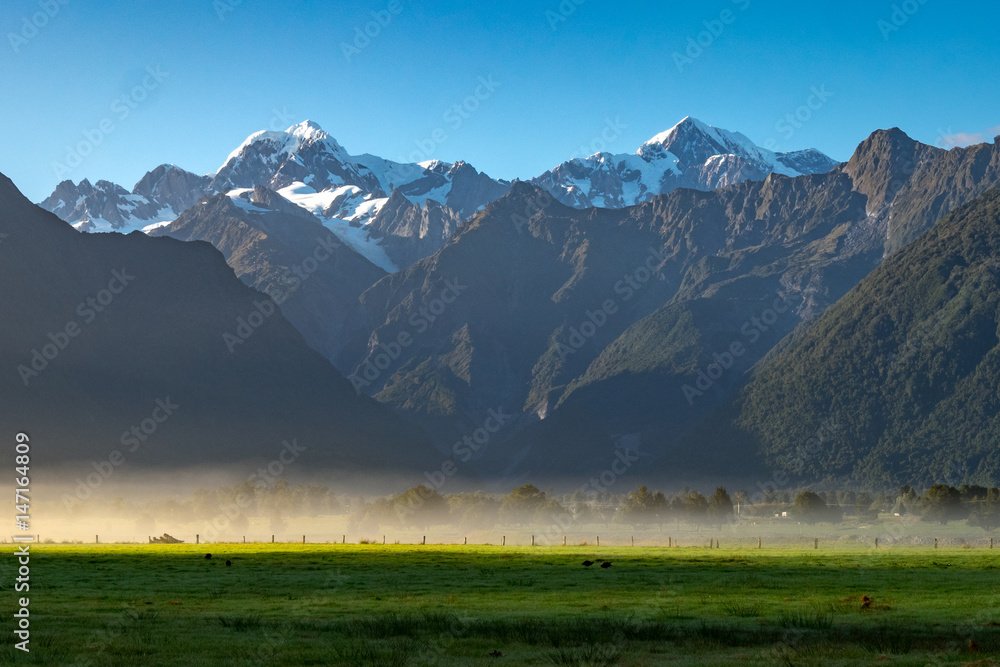View of Aoraki (Mount Cook) and Mount Tasman frome Lake Matheson, West Coast of South Island of New Zealand.It is famous for its reflected views of Aoraki/Mount Cook and Mount Tasman.