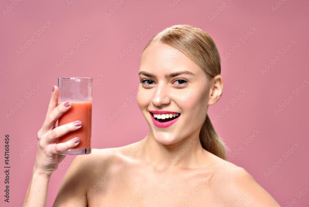 Happy attractive young woman drinking juice Happy attractive young woman drinking juice