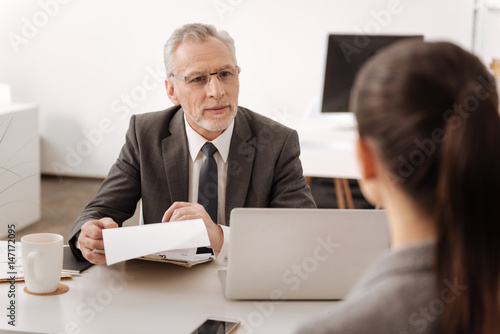 Fotografija Kind male person looking at his secretary