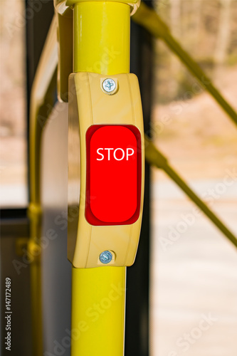 The red stop button in the bus