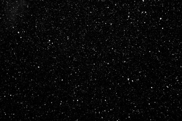 Natural white snow on a black background