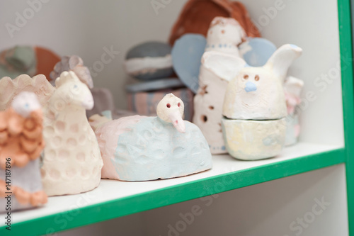 Ceramic products stand on shelves