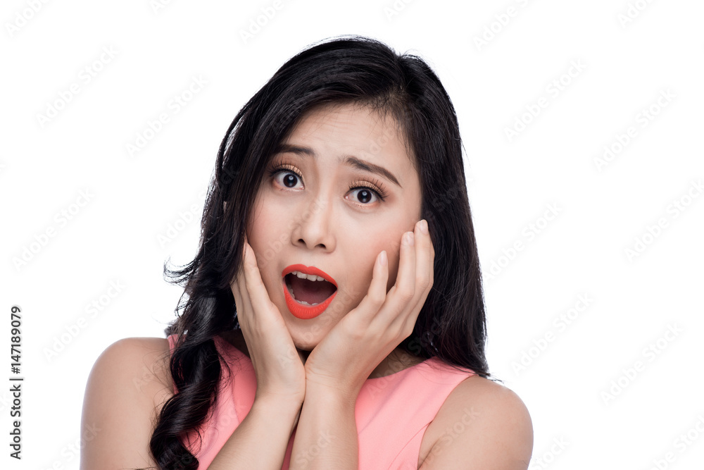 Surprised face of young asian woman over white. Surprised face of young asian woman over white.