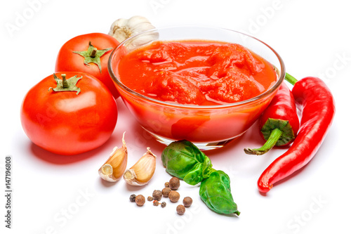 Small glass condiment bowl of red tomato sauce ketchup of peree
