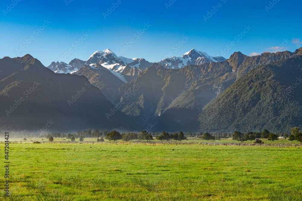  View of Aoraki/Mount Cook and Mount Tasman from Lake Matheson in West Coast of South Island of New Zealand.It is famous for its reflected views of Aoraki/Mount Cook and Mount Tasman.