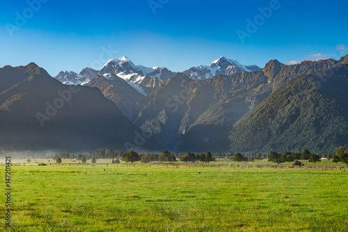  View of Aoraki/Mount Cook and Mount Tasman from Lake Matheson in West Coast of South Island of New Zealand.It is famous for its reflected views of Aoraki/Mount Cook and Mount Tasman.