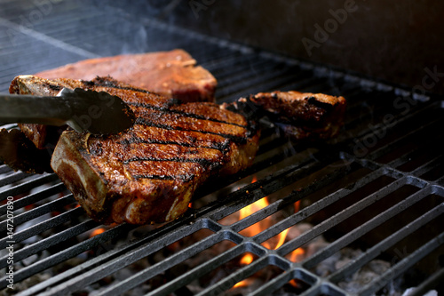 T-Bone Steaks on Barbecue Grill photo