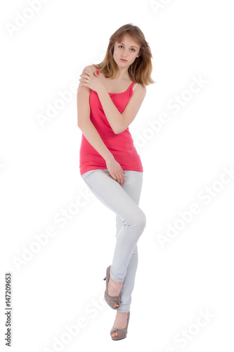 Young beautiful teenager posing over white