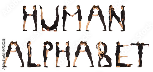 Black dressed people forming word HUMAN ALPHABET