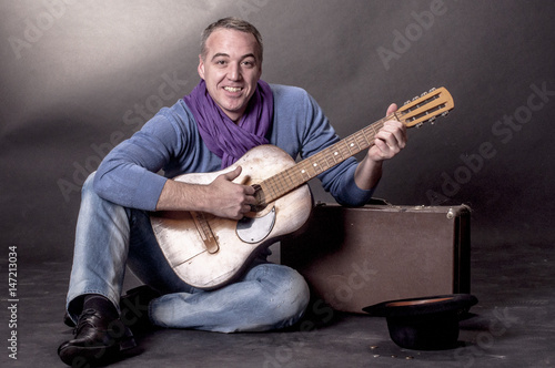 Portrait of elegant man with a guitar

