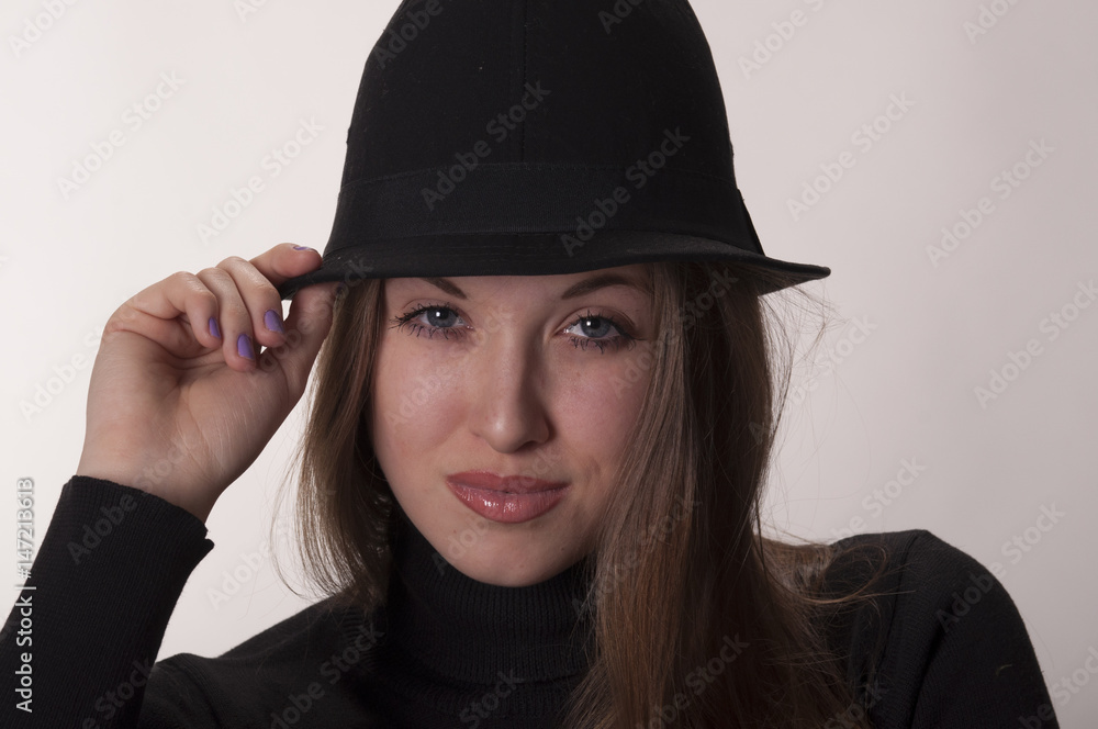 Portrait of a beautiful girl with long hair in a hat
Portrait of a beautiful girl with long hair in a hat