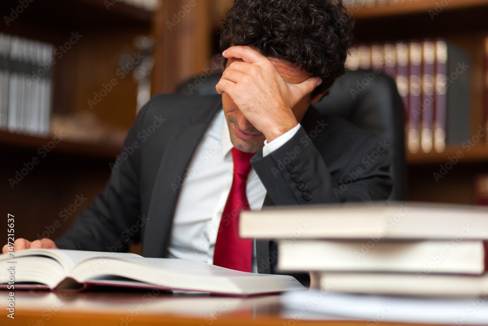 Stressed lawyer in his studio Stressed lawyer in his studio