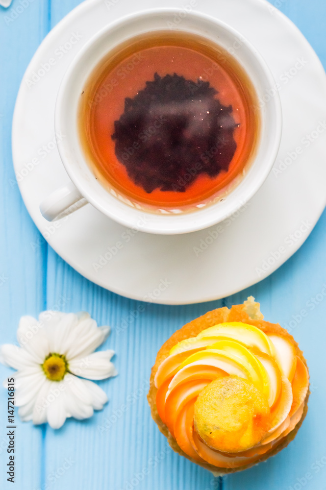 Still life with cup of tea and cake on the wooden background Still life with cup of tea and cake on the wooden background