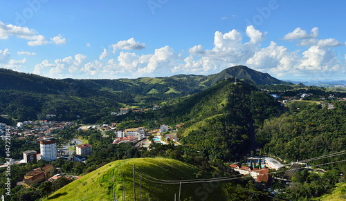 Landscape horizon with a small city in the mountains seen from a high angle photo