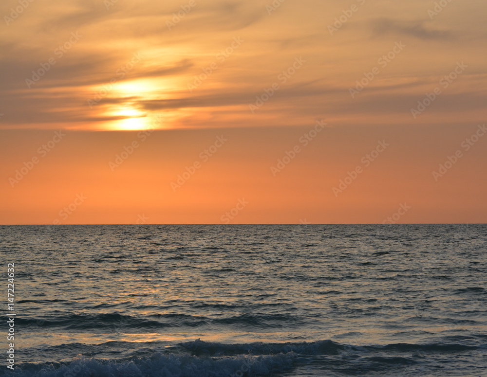 A beautiful sunset over the Gulf of Mexico on Indian Rocks Beach, Florida.